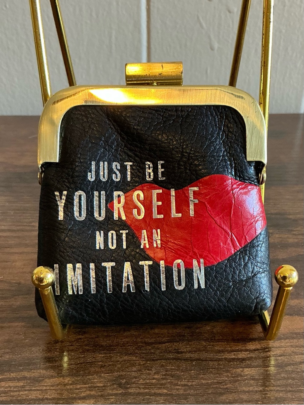 A vintage Diane von Furstenberg Leather Crossbody Kisslock Coin Purse Mini Bag